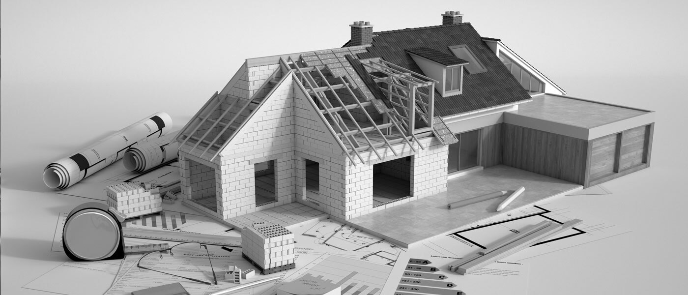 Maquette d'une maison avec plans de construction et outils de mesure